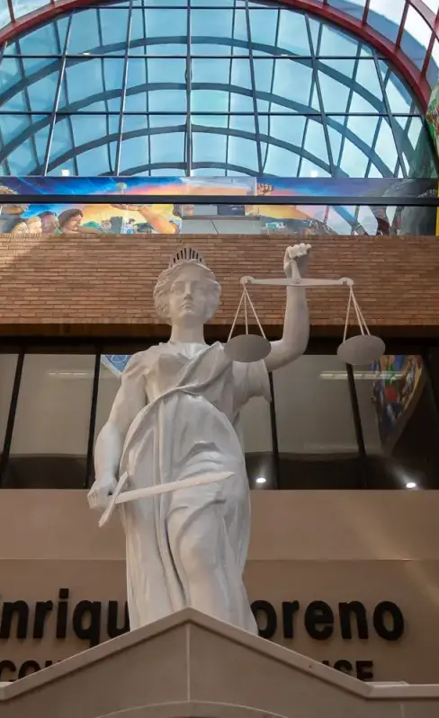 Statue of Lady Justice with blindfold, balance scales, and a sword.